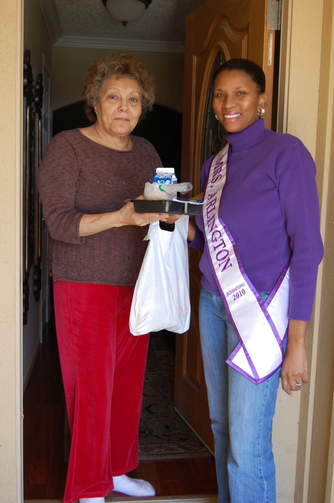 volunteer delivers meal